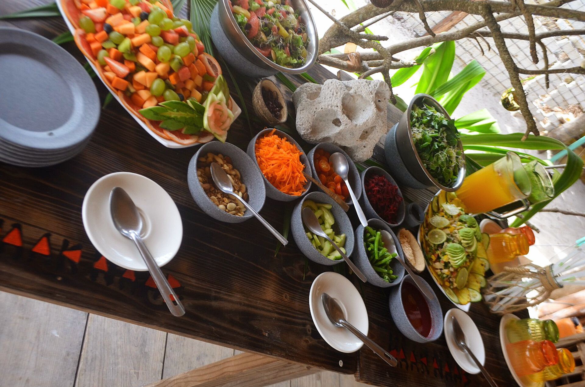 Raw vegan ceviche feast salads and fruit salads. 