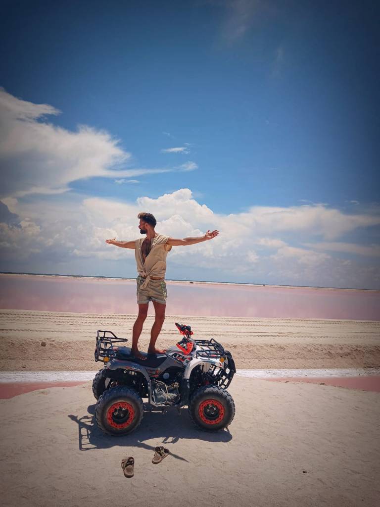 ATV Excursion Las Coloradas Yucatan Salt Flats Pink Water with Pink Flamencos, with EMf RMF Protection armor shorts with neon reflective accents. Holistic Retreats Rivera Maya.