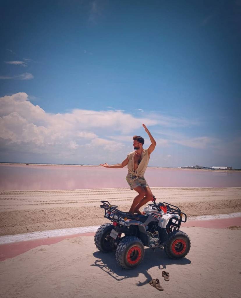 ATV Excursion Las Coloradas Yucatan Salt Flats Pink Water with Pink Flamencos, with EMf RMF Protection armor shorts with neon reflective accents. Holistic Retreats Rivera Maya.